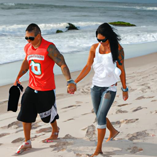 DJ Pauly D and Nikki enjoying a romantic walk on the beach during sunset.